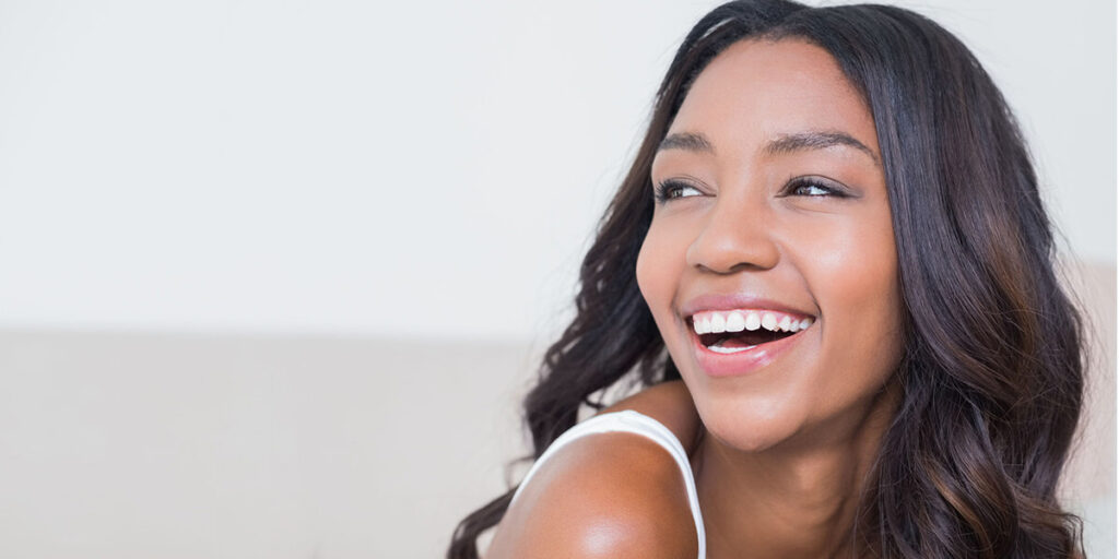 Says yes to Laser Hair Removal for all skin tones. Image shows a African American woman with smooth skin. 